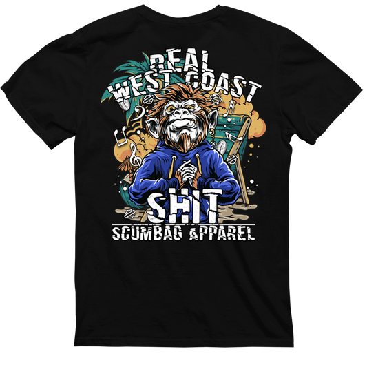 A black t-shirt with a graphic design on the back featuring an illustrated character dressed in a blue hoodie. Text above the illustration reads "REAL WEST COAST." Below it, in larger text, it says "SHIT" followed by "CaliforniaScumbags" at the bottom. The "Real West Coast Shit" is perfect for a hardcore punk vibe.